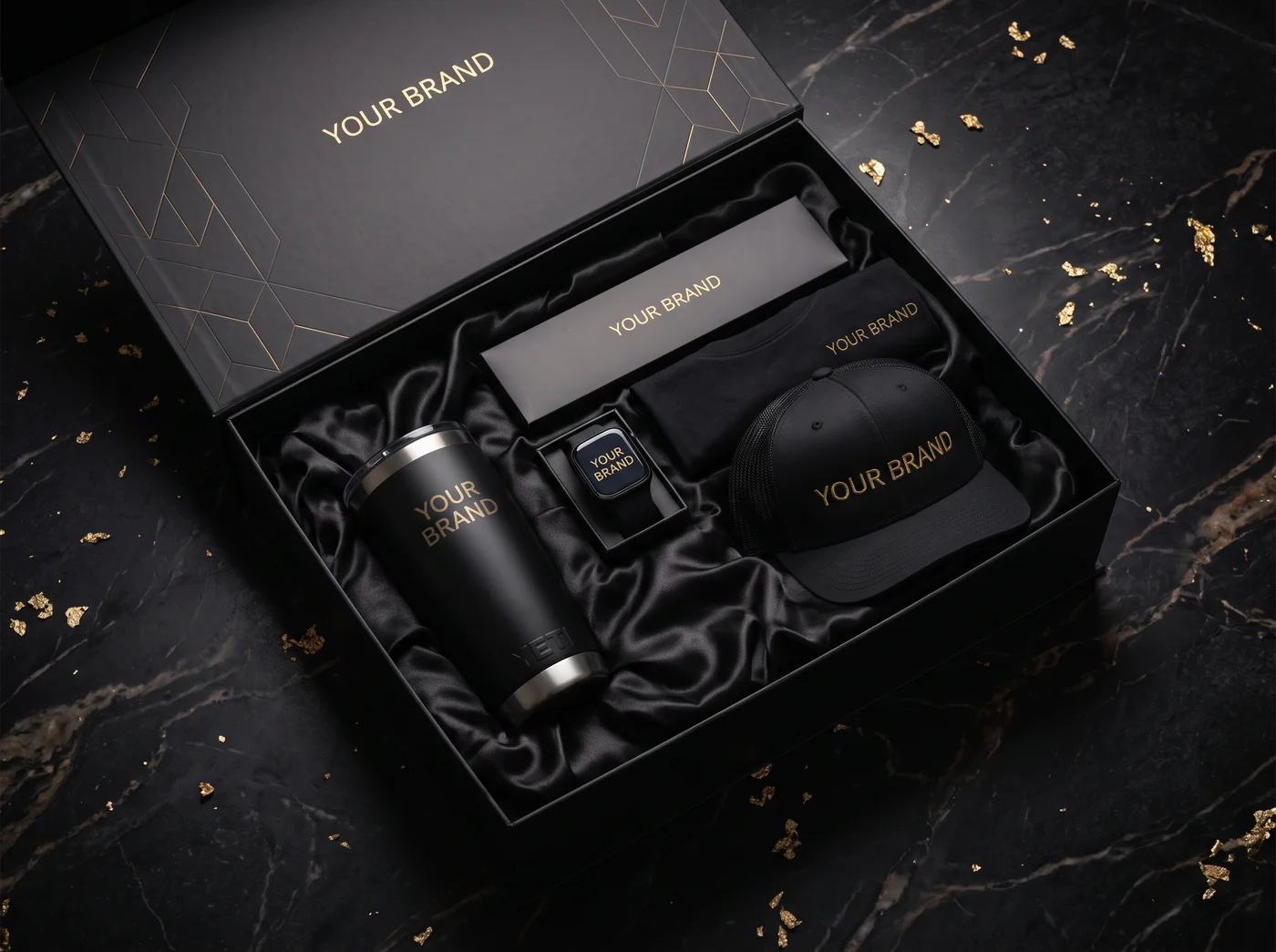 A dark luxury gift box with a tumbler, smartwatch, apparel and cap, an example of a premium corporate gift category